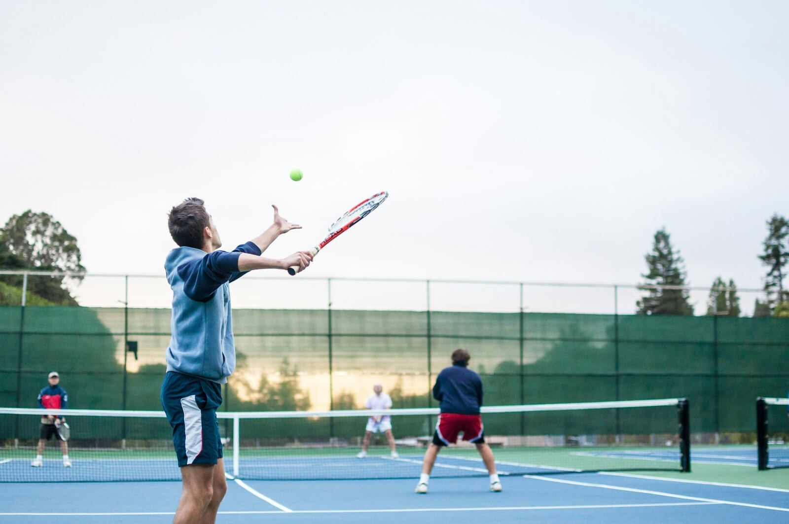 Tennis coach with a player on court